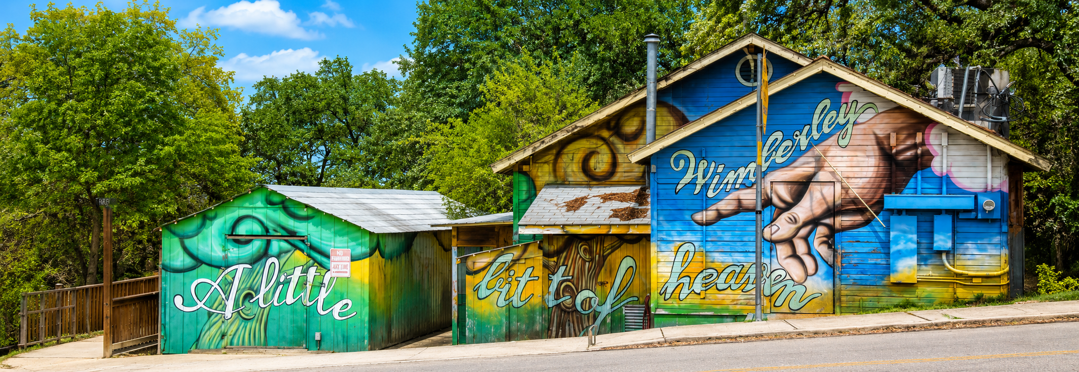 "Wimberley — A little bit of heaven" mural on a downtown building near the Square in Wimberley, Texas